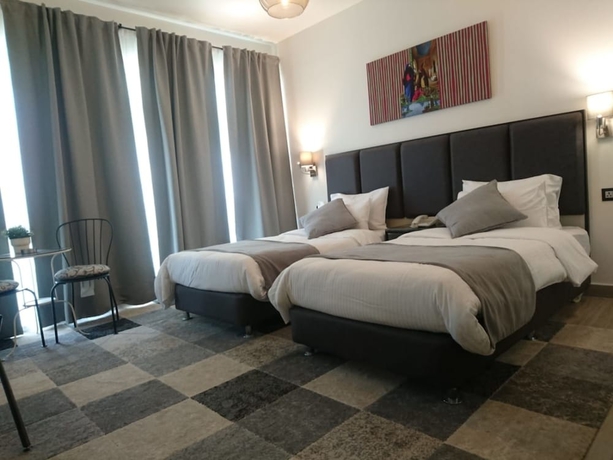 Imagen de la habitación del Hotel The Conroy Boutique. Foto 14