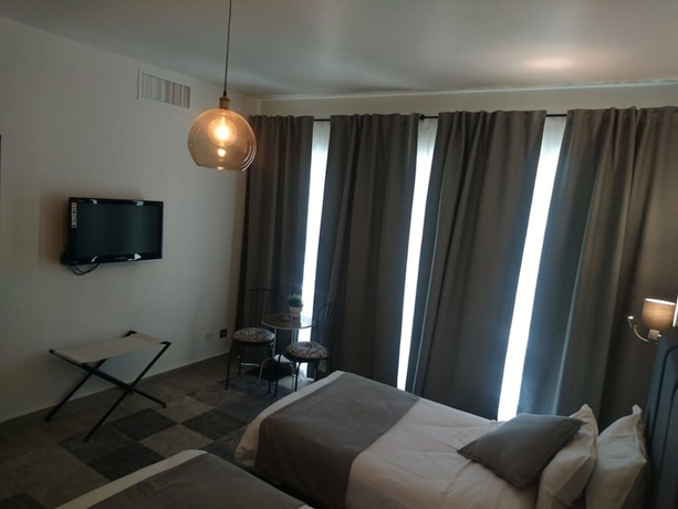 Imagen de la habitación del Hotel The Conroy Boutique. Foto 15