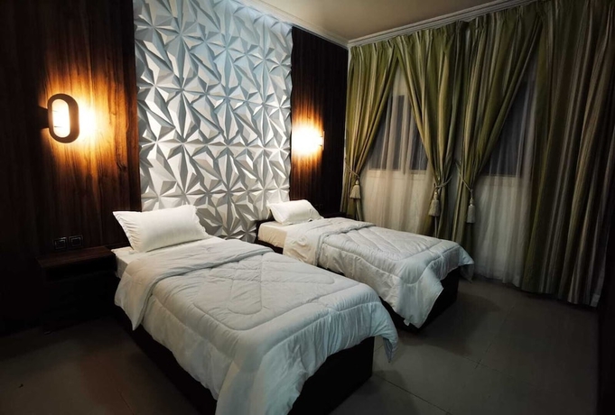 Imagen de la habitación del Hotel The Continent Residence. Foto 1