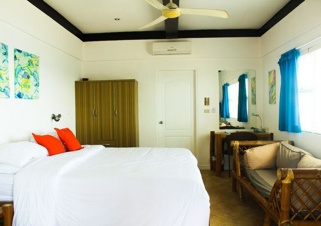 Imagen de la habitación del Hotel The Coral Beach Club. Foto 18