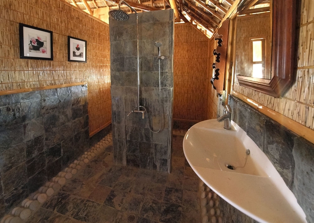 Imagen de la habitación del Hotel The Coral Blue Oriental Beach Villas and Suites. Foto 1