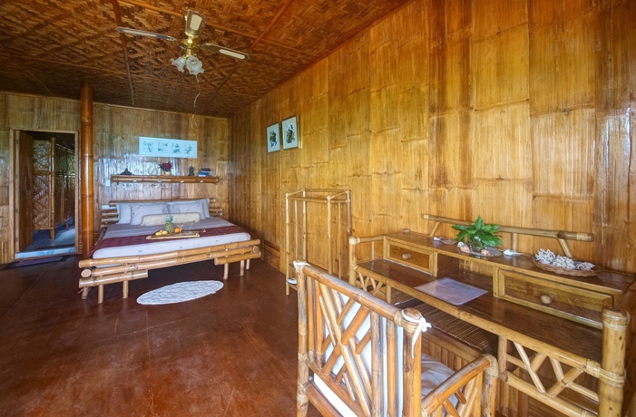 Imagen de la habitación del Hotel The Coral Blue Oriental Beach Villas and Suites. Foto 2