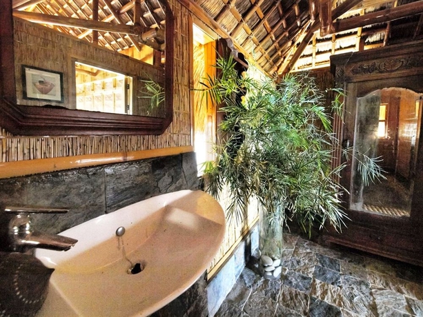 Imagen de la habitación del Hotel The Coral Blue Oriental Beach Villas and Suites. Foto 11