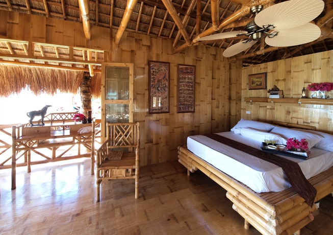 Imagen de la habitación del Hotel The Coral Blue Oriental Beach Villas and Suites. Foto 12