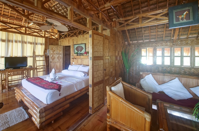 Imagen de la habitación del Hotel The Coral Blue Oriental Beach Villas and Suites. Foto 14