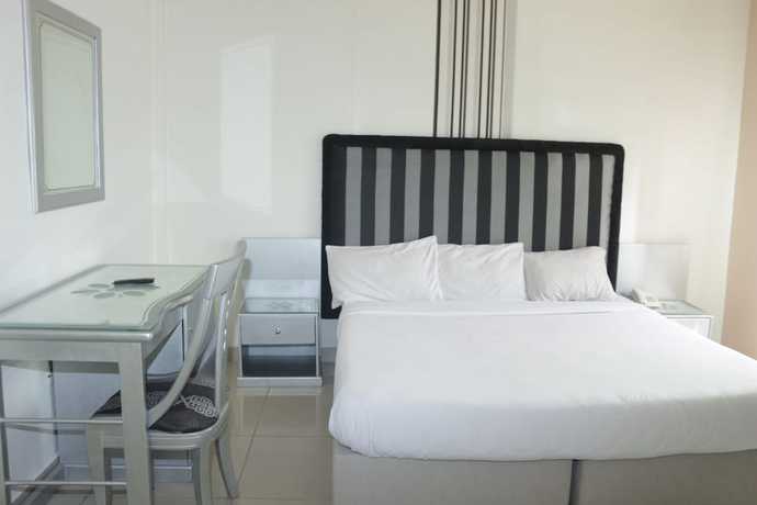 Imagen de la habitación del Hotel The Coral Reef. Foto 17