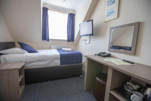 Imagen de la habitación del Hotel The Corner House Gatwick. Foto 6