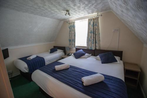 Imagen de la habitación del Hotel The Corner House Gatwick. Foto 10