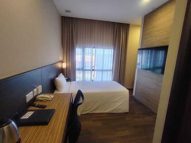 Imagen de la habitación del Hotel The Corner House, Kuala Belait. Foto 7