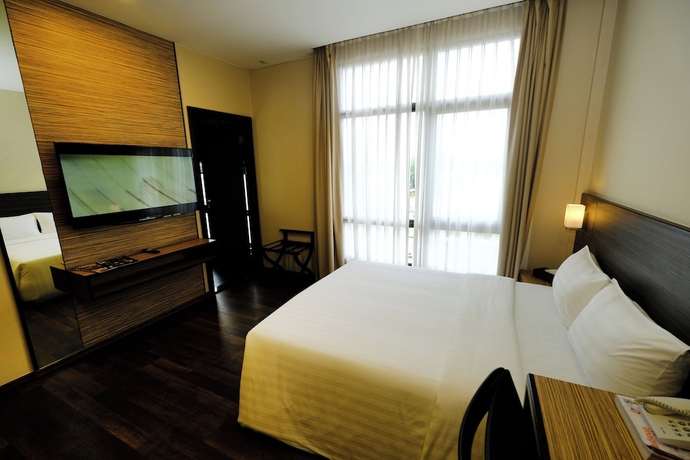 Imagen de la habitación del Hotel The Corner House, Kuala Belait. Foto 9