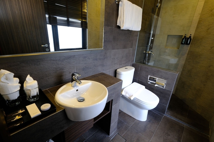 Imagen de la habitación del Hotel The Corner House, Kuala Belait. Foto 13