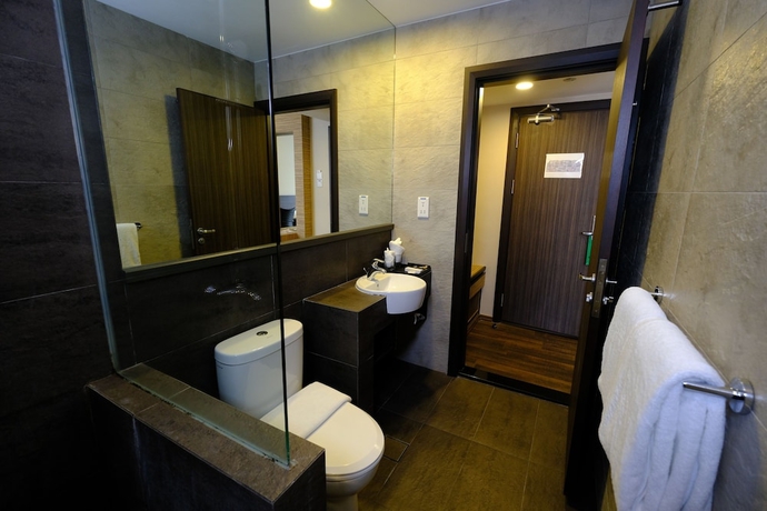 Imagen de la habitación del Hotel The Corner House, Kuala Belait. Foto 14