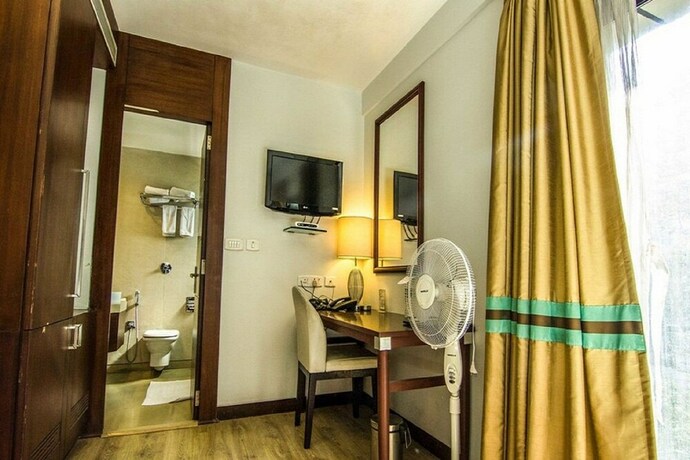 Imagen de la habitación del Hotel The Corporate. Foto 22