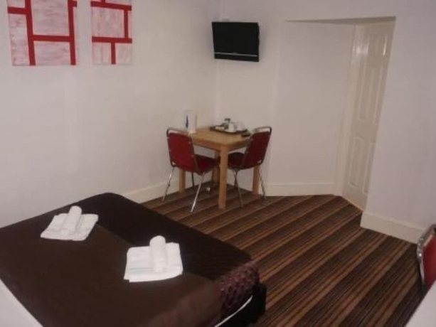 Imagen de la habitación del Hotel The Cotswold. Foto 4