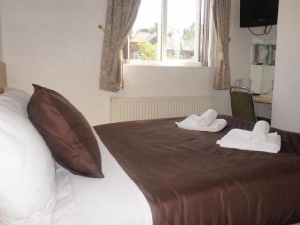 Imagen de la habitación del Hotel The Cotswold. Foto 11