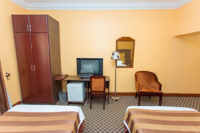 Imagen de la habitación del Hotel The Country Inn. Foto 11