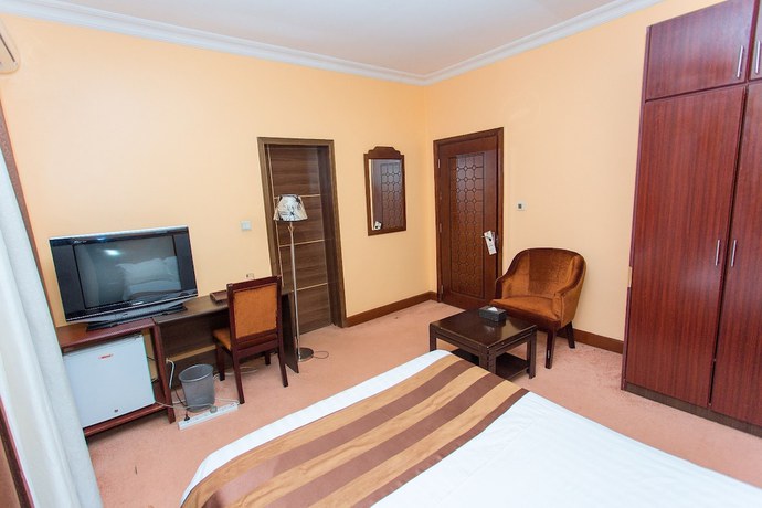 Imagen de la habitación del Hotel The Country Inn. Foto 18