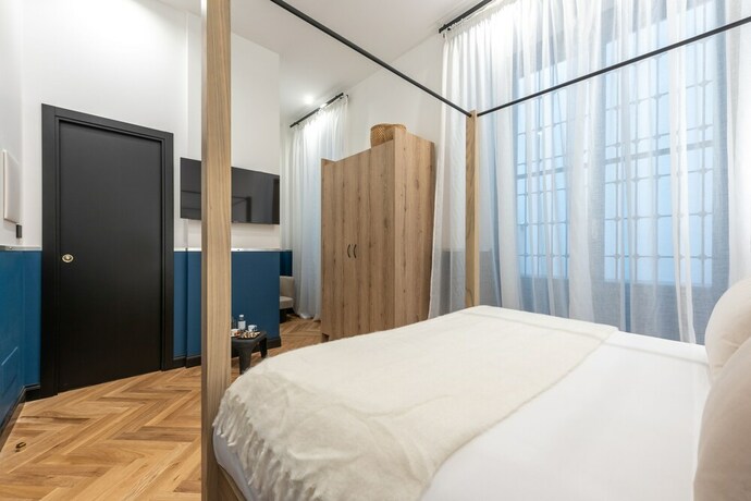 Imagen de la habitación del Hotel The Couper Castello. Foto 20