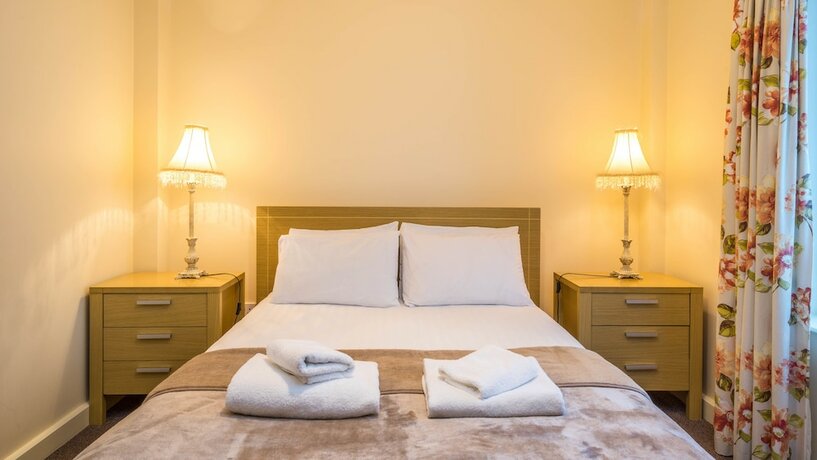 Imagen de la habitación del Hotel The Courtyard Apartments. Foto 16