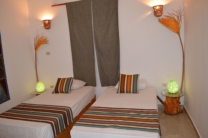 Imagen de la habitación del Hotel The Cozy Beach House. Foto 4