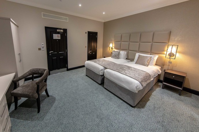 Imagen de la habitación del Hotel The Crescent Hyde Park. Foto 3