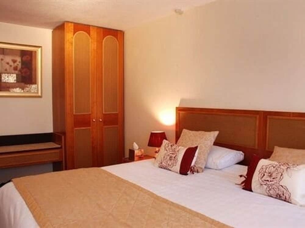 Imagen de la habitación del Hotel The Crown House. Foto 15