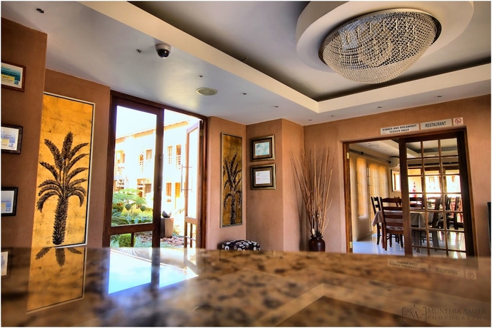 Imagen de los interiores del Hotel The Cycad Lodge And Chalets. Foto 18