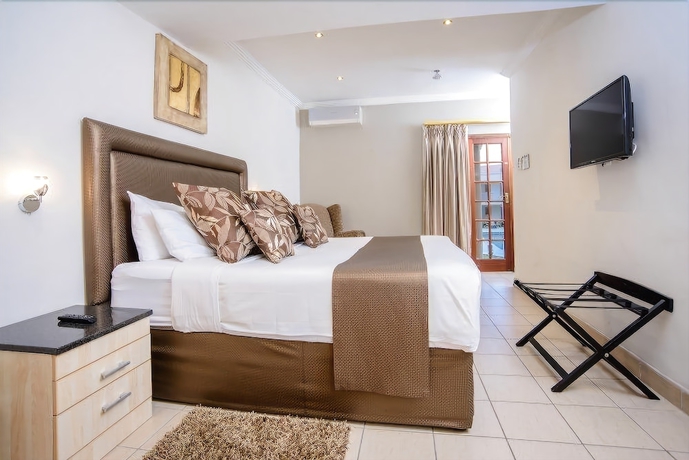 Imagen de la habitación del Hotel The Cycad Lodge And Chalets. Foto 17