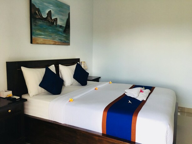 Imagen de la habitación del Hotel The Dagan Bungalow. Foto 18