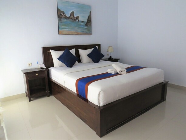 Imagen de la habitación del Hotel The Dagan Bungalow. Foto 21