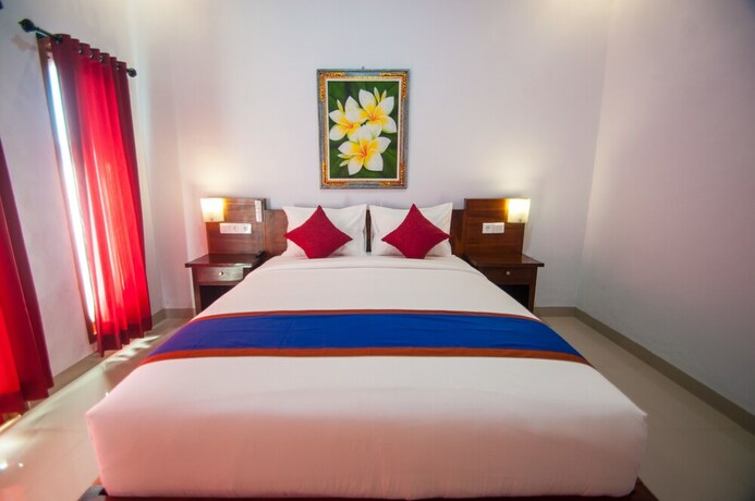 Imagen de la habitación del Hotel The Dagan Bungalow. Foto 23