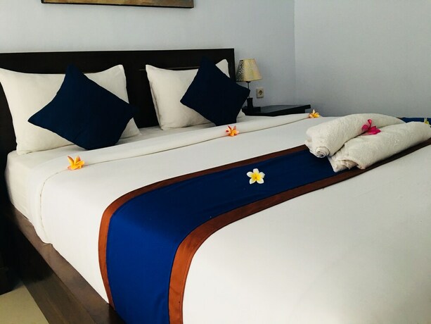 Imagen de la habitación del Hotel The Dagan Bungalow. Foto 29