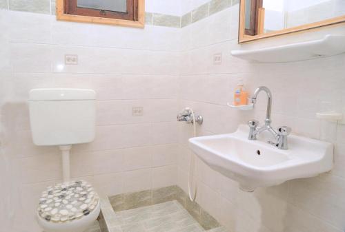 Imagen de la habitación del Hotel The Delfini. Foto 6