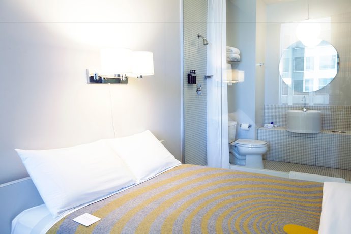 Imagen de la habitación del Hotel The Delphi. Foto 10