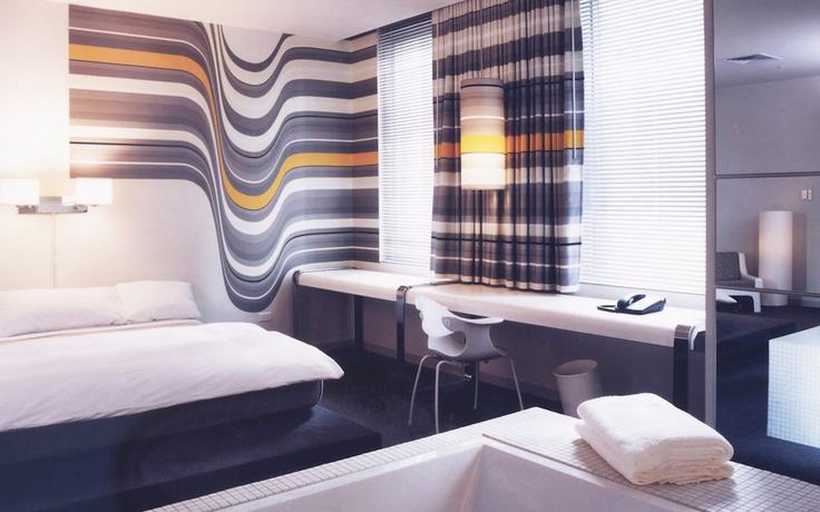 Imagen de la habitación del Hotel The Delphi. Foto 19