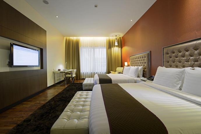Imagen de la habitación del Hotel The Deltin. Foto 6