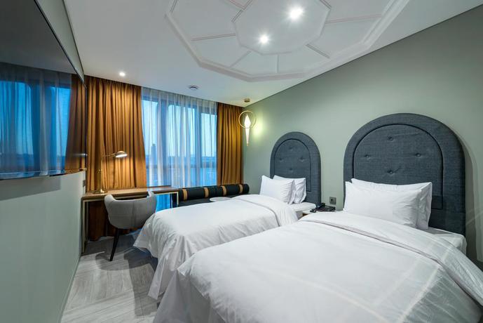 Imagen de la habitación del Hotel The Designers Ddp. Foto 8