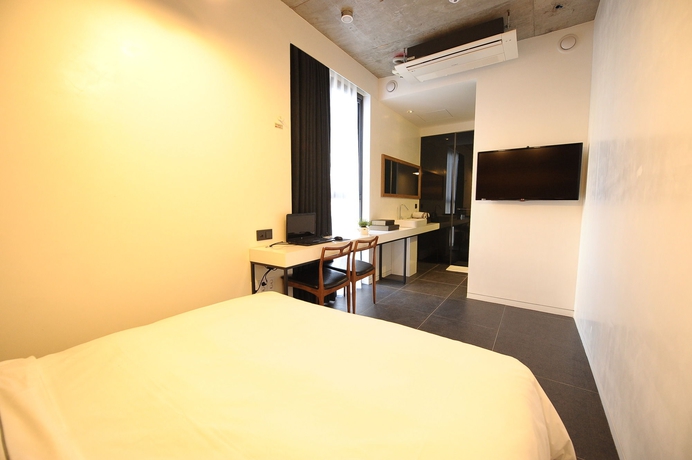 Imagen de la habitación del Hotel The Designers Jongno. Foto 3