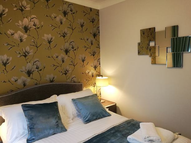 Imagen de la habitación del Hotel The Devon Court. Foto 5