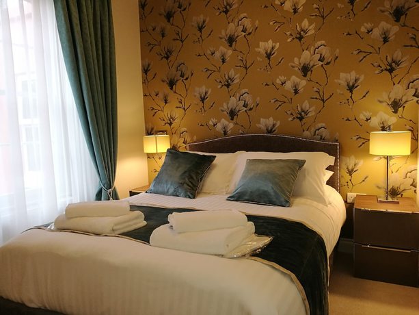 Imagen de la habitación del Hotel The Devon Court. Foto 8