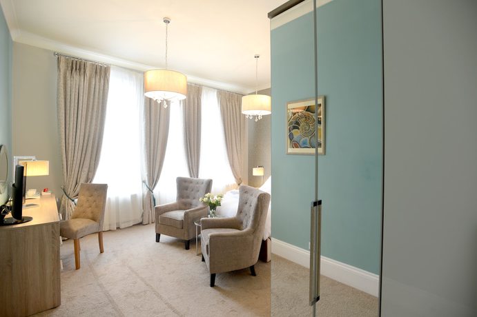 Imagen de la habitación del Hotel The Devon Court. Foto 9