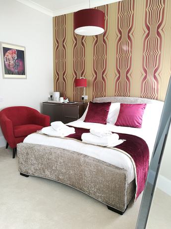 Imagen de la habitación del Hotel The Devon Court. Foto 12