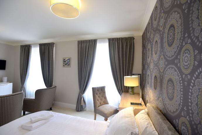 Imagen de la habitación del Hotel The Devon Court. Foto 14