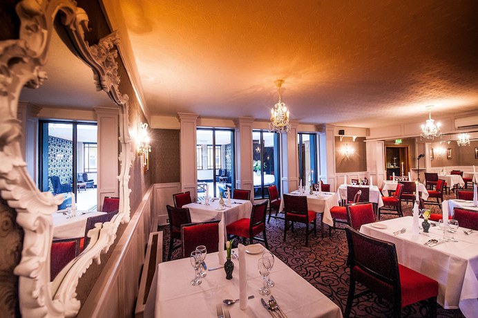 Imagen del bar/restaurante del Hotel The Devon Inn. Foto 3