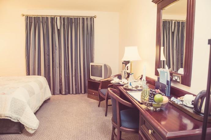 Imagen de la habitación del Hotel The Devon Inn. Foto 10