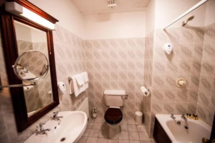 Imagen de la habitación del Hotel The Devon Inn. Foto 12