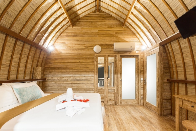 Imagen de la habitación del Hotel The Dewi Premier. Foto 7