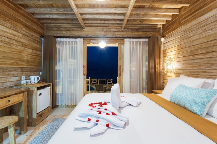 Imagen de la habitación del Hotel The Dewi Premier. Foto 10