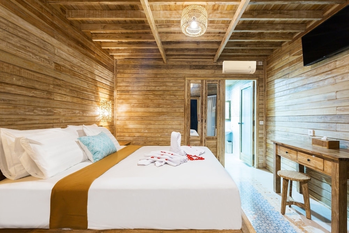 Imagen de la habitación del Hotel The Dewi Premier. Foto 11