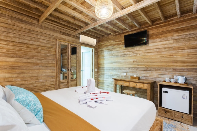 Imagen de la habitación del Hotel The Dewi Premier. Foto 13